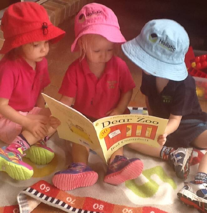 STARS: Children reading at Lindy Clinch's family day care in Scone.