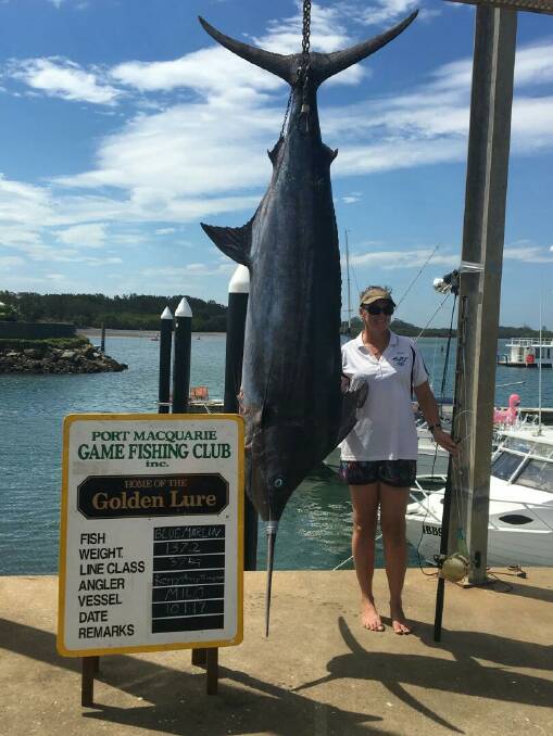 HEAVY: Aberdeen angler Kerryanne Thompson with her 137.2kg blue marlin, which she caught off Port Stephens Fishing Club boat Milo during the Golden Lure tournament at Port Macquarie.