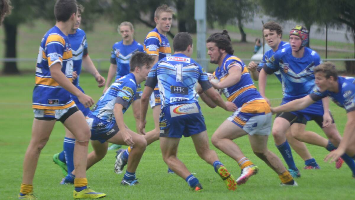 STOP ME IF YOU CAN: Muswellbrook Rams fullback Brad Collett hits the line strongly at Olympic Park on Sunday.