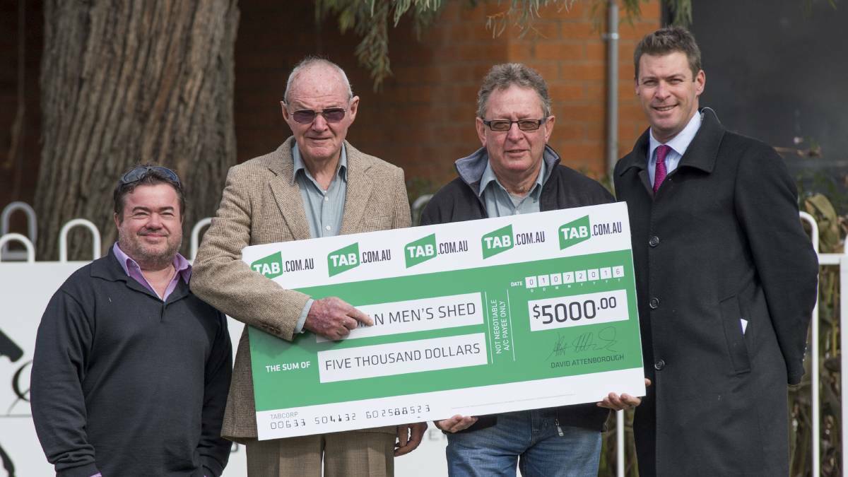 GENEROUS: Aberdeen Men's Shed members Paul Hobbs and Maurie Wadwell receive their $5000 donation from Upper Hunter editor Rod Thompson (left) and Sky presenter Richard Haynes (right) in 2016. Pic: KATRINA PARTRIDGE PHOTOGRAPHY