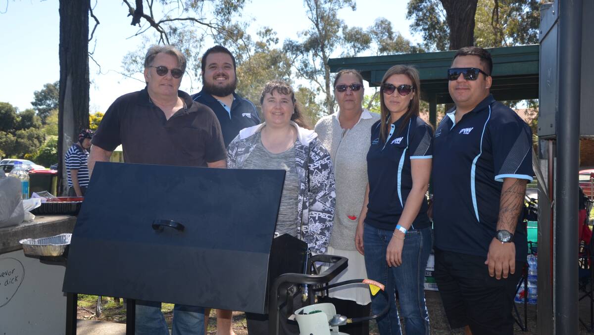 SERVING UP A FEAST: The team from Compass Housing Services at Hunter Park on Wednesday.