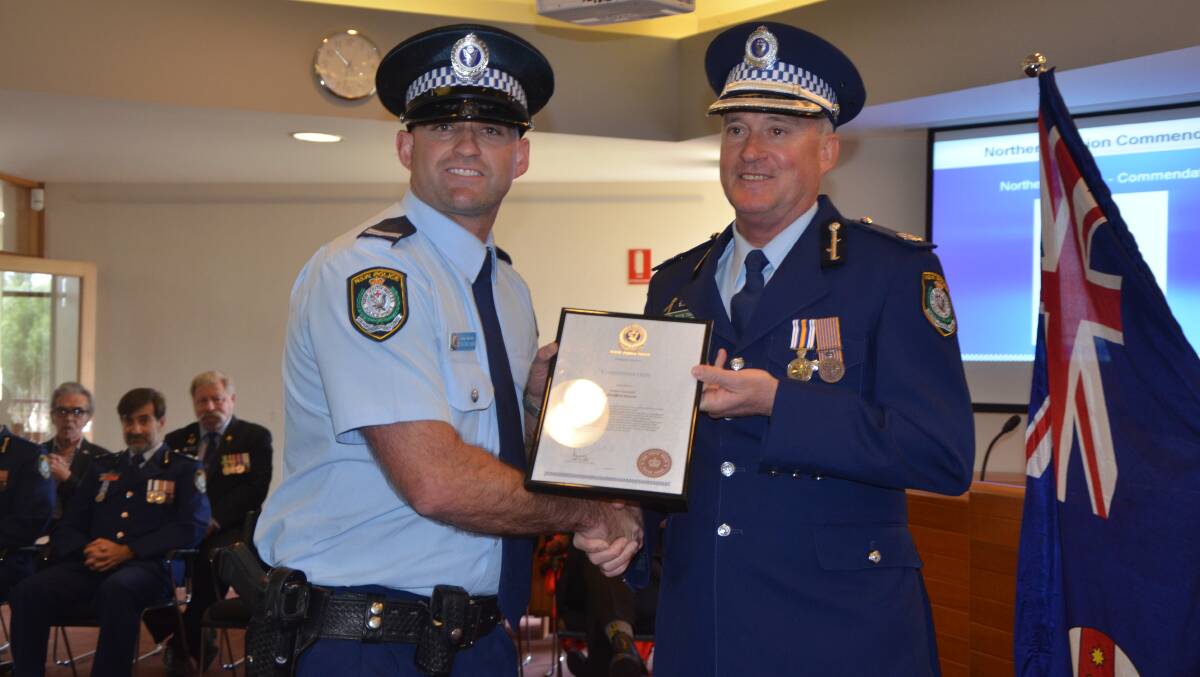 RECOGNITION: Senior Constable Steffen Durie and Northern Region Acting Assistant Commissioner Peter Thurtell at the Hunter Valley Local Area Command Awards at the Muswellbrook Shire Council chambers on Friday.