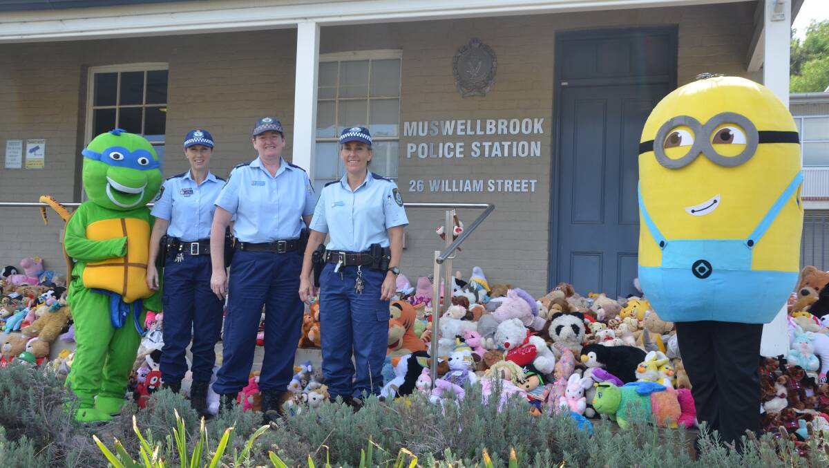 COMMUNITY SUPPORT: A Teenage Mutant Ninja Turtle and a Minion dropped off 500 soft toys to Hunter Valley Local Area Command officers Libby Symos, Sheree Gray and Keli Bastick on Thursday.