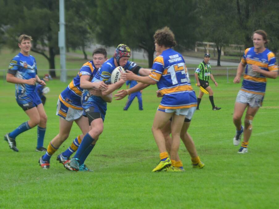 FORWARD SURGE: Greta Branxton Colts under-18 front-rower Brock Mackintosh charges into the fray against the Muswellbrook Rams on Sunday.