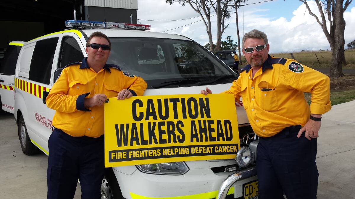 CHARITABLE: Michael Gillis and Jeff Jackson at the front of the Lochinvar Rural Fire Brigade station after successfully completing the 2015 walk. Pic: DANIEL JOHNSON IMAGING