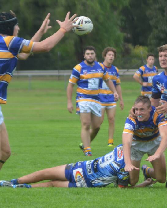 TRY TIME: Muswellbrook Rams playmaker Paul Dengate fires out a pass to Fletcher Baker, who dived over the line near the corner at Olympic Park on Sunday.