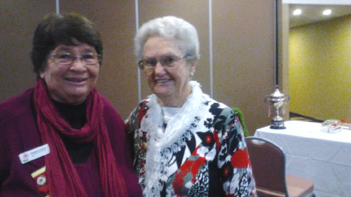 CATCHING UP: Meeting at the Red Cross Zone 5 Conference after 35 years were Shirley Beveridge, of Muswellbrook, and guest speaker Margaret Kiehne, of Glen Innes, where both played golf together.