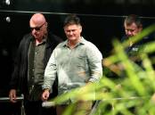 Graham McBride, who lost his wife and daughter Nadene and Kyah, and Matt Mullen, who lost his daughter Bec Mullen, leave Newcastle court yesterday. Picture by Peter Lorimer
