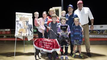 Michael and Jacqui Sheather and their boys, Maree Smith, and GRNSW CEO Rob Macaulay, celebrate the win of Bella Una in the Ladbrokes Country Classic at Dubbo. Picture: Jason McKeown.
