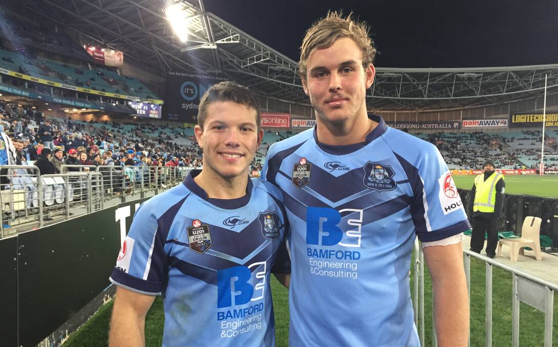 CHAMPIONS: NSW under 20s pair Jack Cogger and Cory Denniss on a victory lap around the Olympic Stadium on Wednesday. Picture: Josh Callinan
