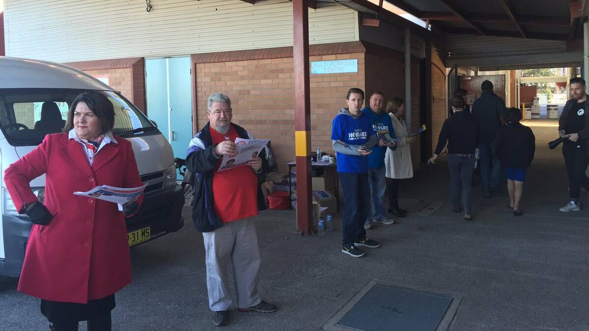 CONTEST: Liberal Karen Paterson and Labor's Meryl Swanson handed out leaflets side-by-side in Rutherford since 7am. Picture: Nick Bielby