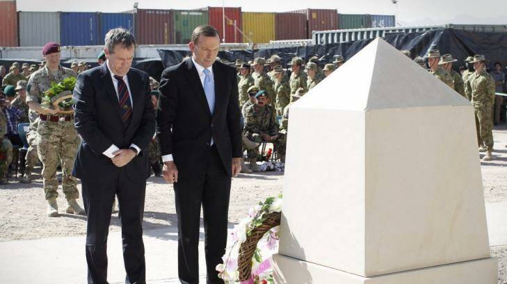 Opposition Leader Bill Shorten and Prime Minister Tony Abbott lay wreaths during a recognition ceremony in Tarin Kowt, Oruzgan Province, Afghanistan to honour the 40 Australian lives lost during the conflict. Photo: Andrew Meares