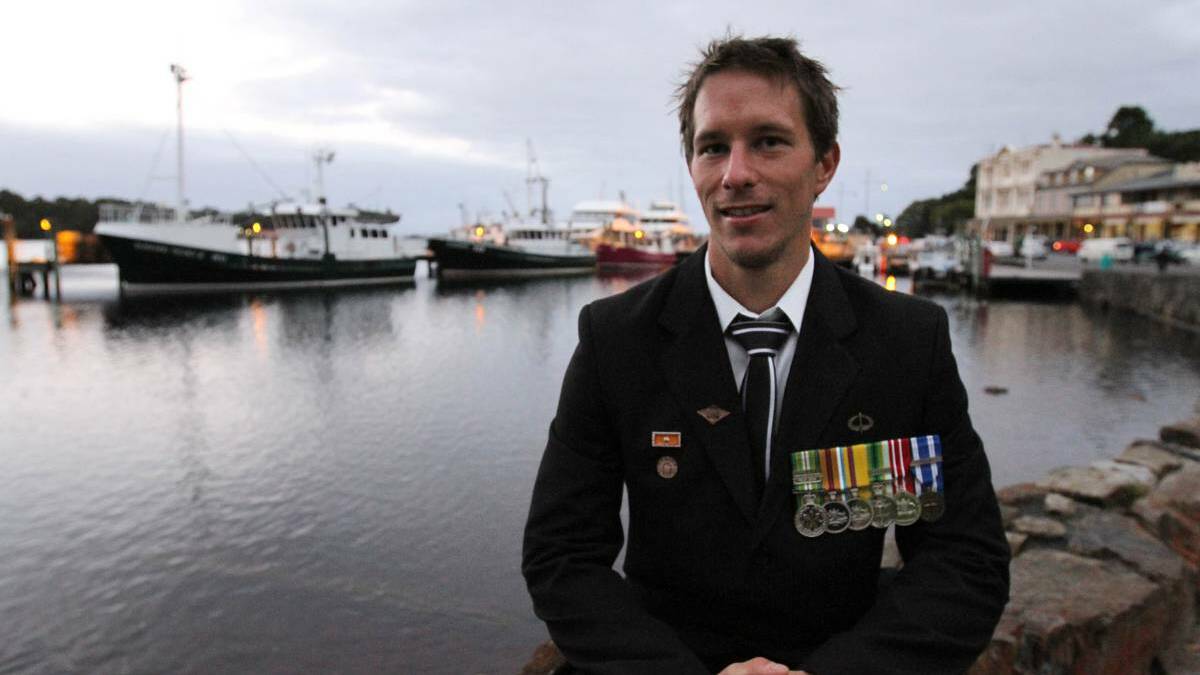 BURNIE: Residents turn out to the Anzac Day dawn service at Strahan. Photo: Grant Wells, The Advocate.