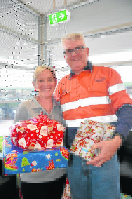 TOY STORY: Glencore’s administration officer Jo Tull and environment and 
community manager Andrew Kelly with some of the gifts.
