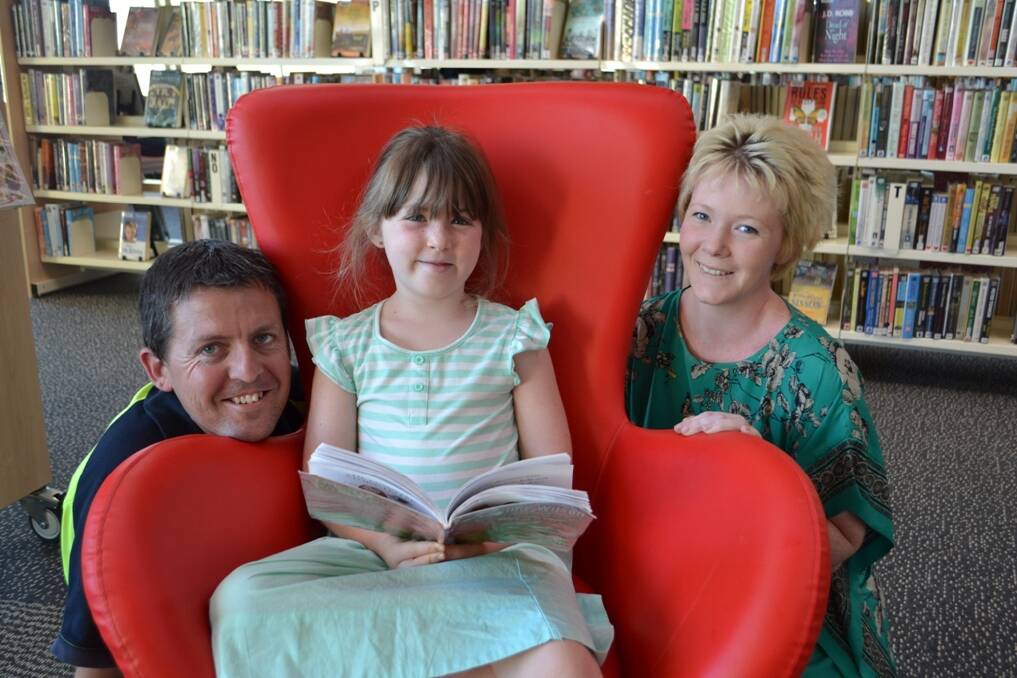 Looking forward to Singleton Library's Summer Reading Program are Dave, Willow and Lili Damaso.