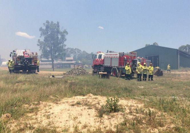 FIRES RAGE: Fire fighters across the Hunter work hard to contain blazes.  Tragically one volunteer with the RFS died from a suspected heart attack.  Pic: Courtesy Fire and Rescue NSW Facebook page.