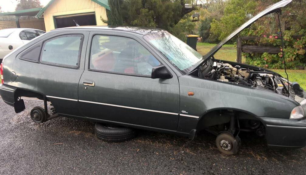 GOING NOWHERE:  Vandals made short work of this vehicle in Merriwa’s Elizabeth Street at the weekend. It is – or was - driven by an 81-year-old woman. Pic: Courtesy www.facebook.com