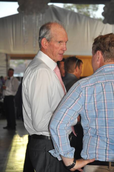 NRL coach, Wayne Bennett, takes an opportunity to chat to one of the guests.