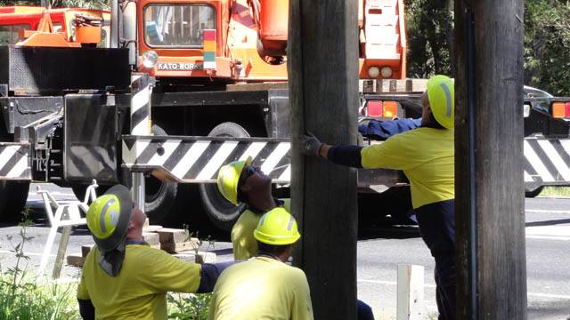 Linesmen working on high-voltage wires and power poles (file shot).  Pic: Courtesy www.ausgrid.com.au
