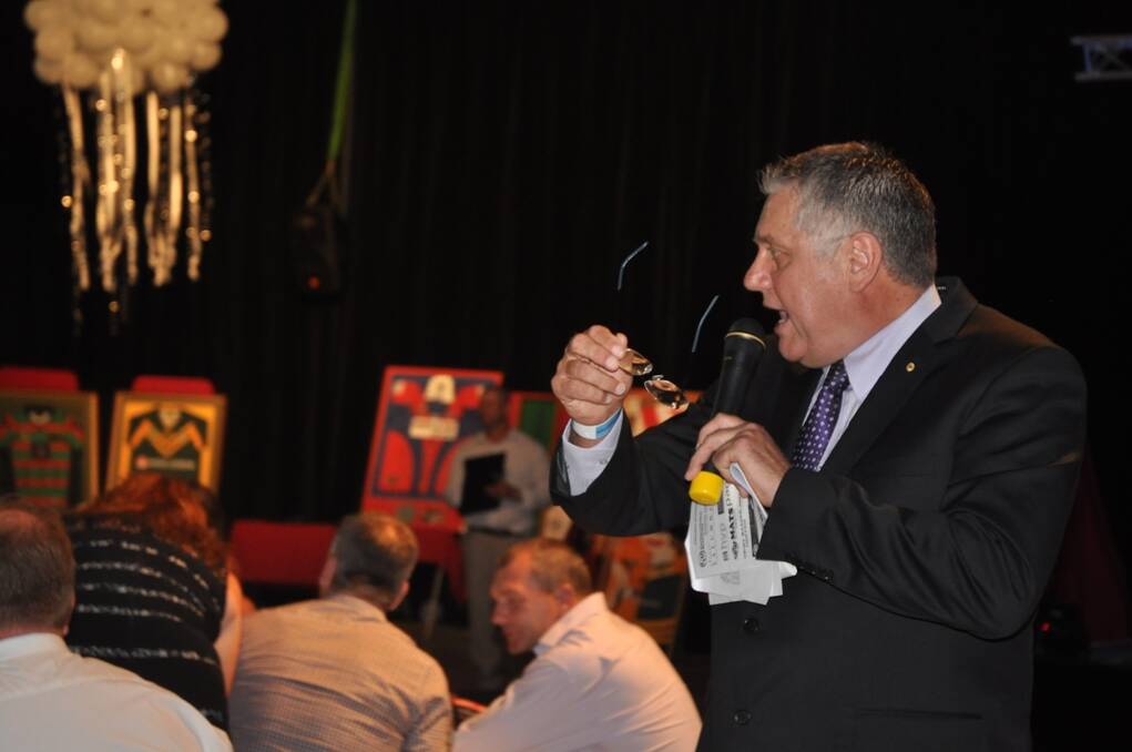 Ray Hadley, broadcaster by day and auctioneer by night, separated the crowd from its cash in record time as money flowed in to help the injured Newcastle Knights player. 