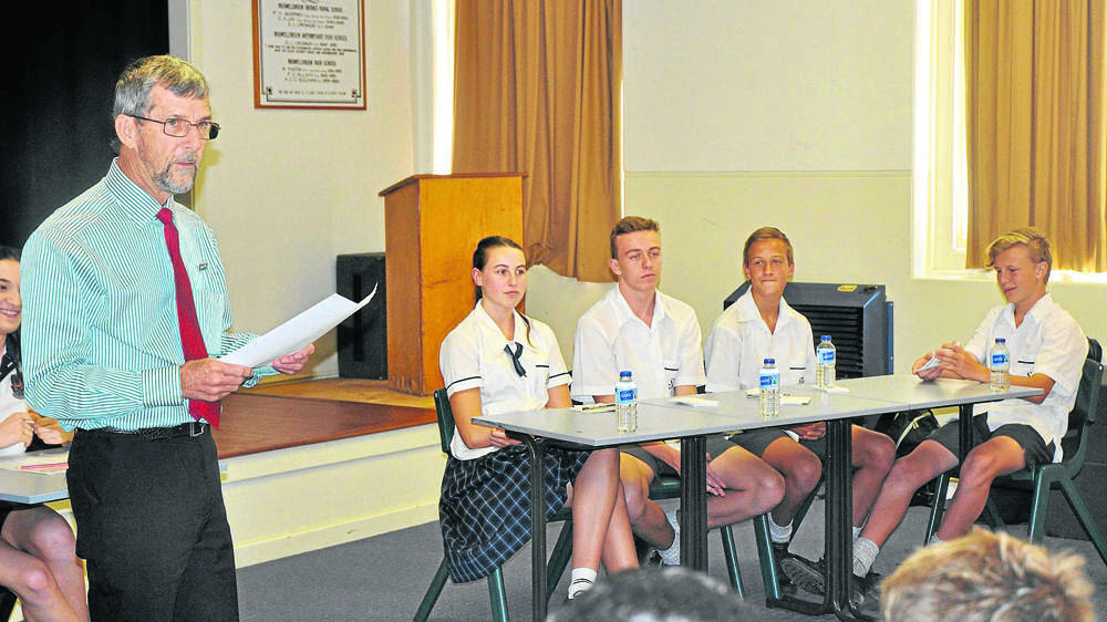 ANNOUNCEMENT: Judge Graham Turvey gave tips to each student, and the senior St Joseph’s Aberdeen team, from left, Bella Fitzgerald, Nick Warburton, James Drayton and Matt Sokulsky, listened.