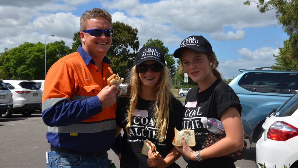 SUPPORT: Simon Coleman with Alanna, 14, and Hannah, 16, at the Community Day in Singleton on Saturday.