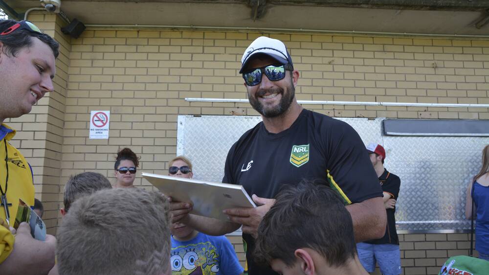 STAR POWER: Former Parramatta Eels rugby league great Nathan Hindmarsh signs autographs at Olympic Park, Muswellbrook, on Wednesday afternoon.