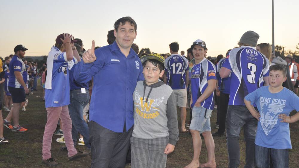 NUMBER ONE: Greta Branxton Colts coach Ron Griffiths and son Warrali celebrate the team’s nail-biting 18-16 win over the Denman Devils on Sunday.