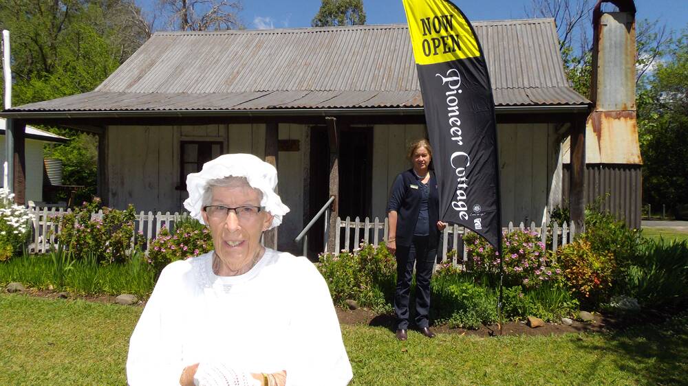 HISTORY: Carmel Hughes (front) and Upper Hunter Shire Council’s Heather Ranclaud invites visitors to the historic Pioneer Cottage this 
weekend.