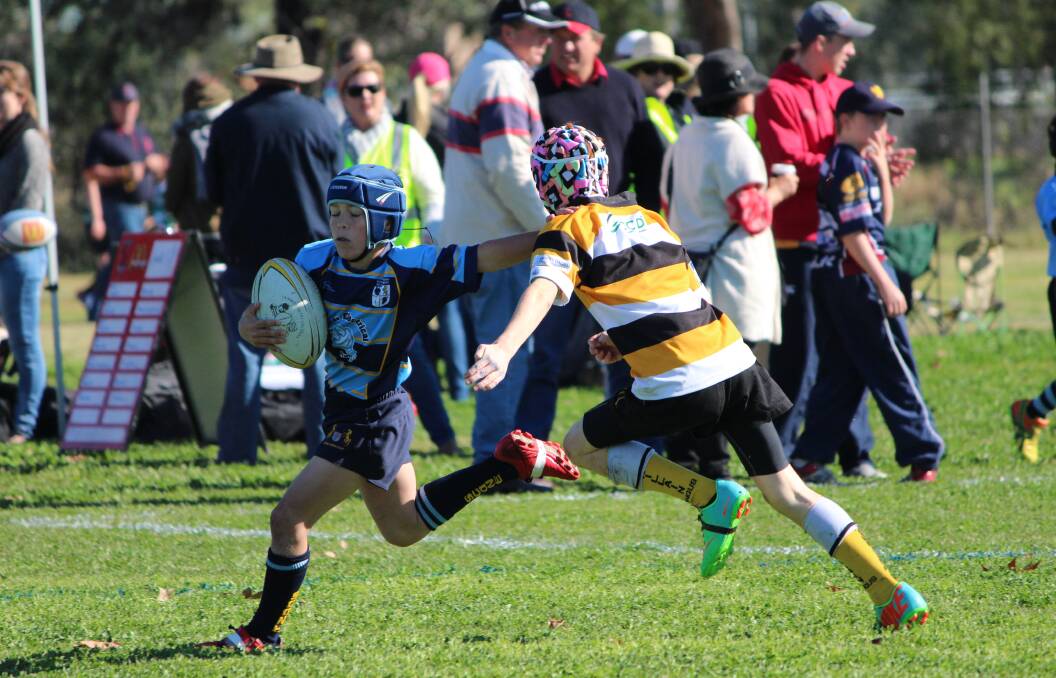 LINE BREAK: Scone under-10s player Cody Grimes in action at a previous carnival. His versatility helped Scone to score several exciting tries during the Gala Day at Quirindi.
