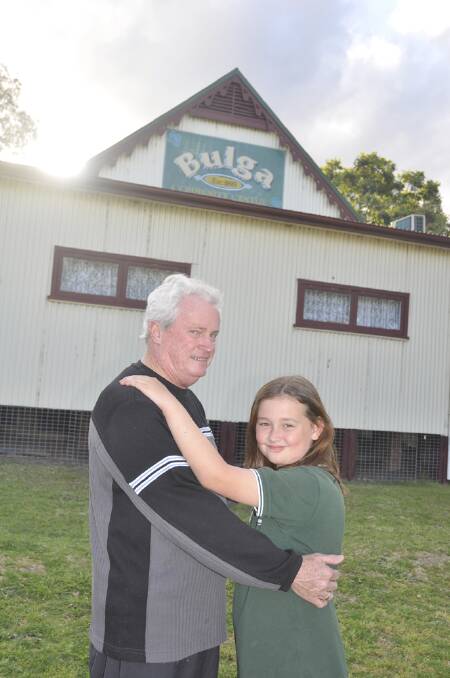 Denman Community Centre's Phil Reid and his granddaughter Paige Doige, 9, are looking forward to the upcoming Bulga community dance.
