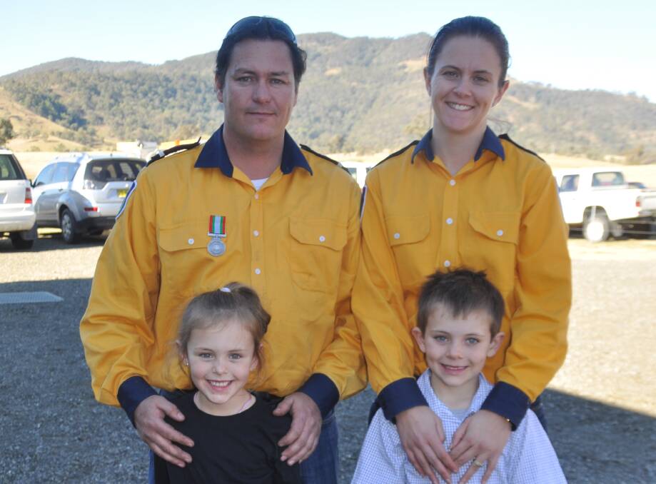 MEMORABLE MOMENT: Trent Wagstaff, who was presented with a Long Service medal for 17 years, and wife Erika from Darlington Rural Fire Brigade with their children Matilda, 6, and Damien, 7.