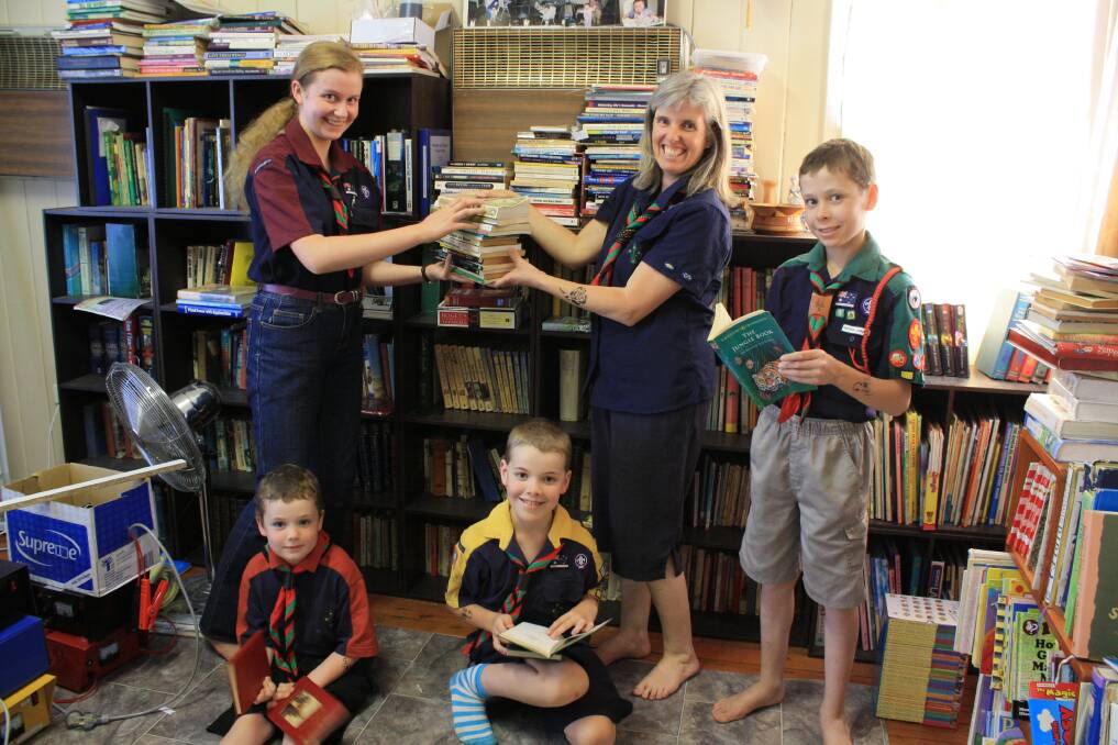 OCTOBER: READ ABOUT IT: 2nd Muswellbrook Scouts members, at back, Amanda, 16, Cub Scout Leader Gwen Thring, Jason, 13, and, front, Dale, 6, and Christopher Thring, 10, are looking forward to helping sift through all the books and jumble at the sale.