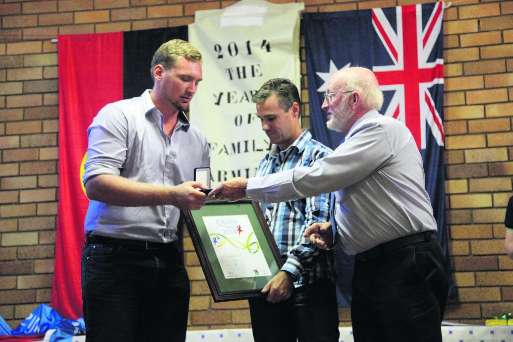 HUMBLED: Tyler Austin received the Young Citizen of the Year award from councillor Ron Campbell and Australia Day Ambassador Matt Hall for both Merriwa and the Upper Hunter Shire for his academic, sporting and community achievements.