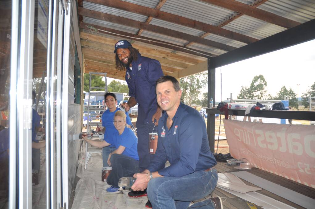 JUNE: HELPING OUT:From left, Karla Bastone, Angela Pursey, Wests Tigers star Lote Tuqiri and Newcastle Knights legend Paul Harragon lend a hand at Scone.