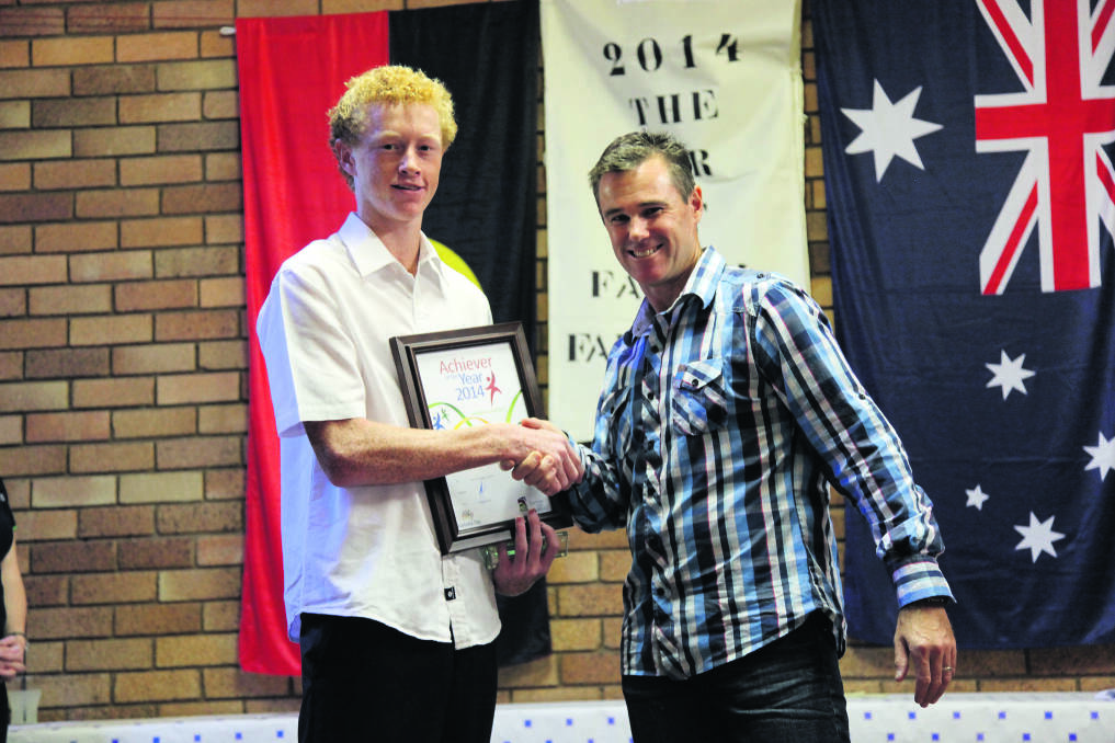 HIGH FLIER: Australia Day Ambassador Matt Hall (right) presented Merriwa Central School student Lachlan Walmsley with the Achiever of the Year Award on Sunday.