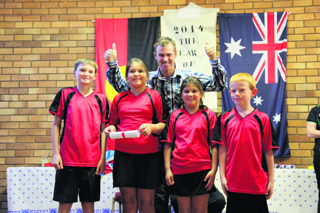 GOOD SPORTS: Australia Day Ambassador pilot Matt Hall gave the thumbs up to the Cassilis Public School touch football team members for their nomination as Community Group of the Year.