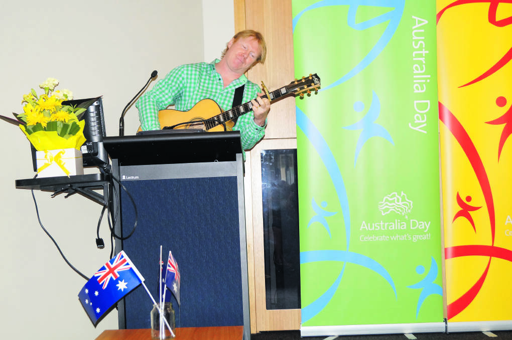 MUSICAL TALENT: Australia Day Ambassador country singer Darren Coggan performs a tune during his address at Scone.
