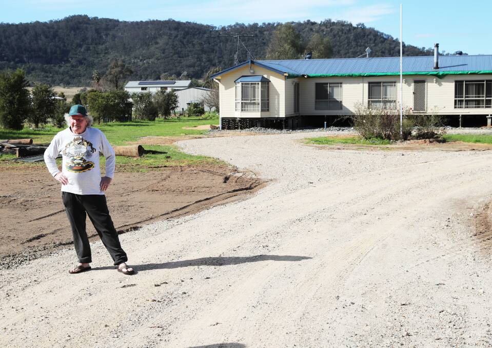 Geoff Minnis standing where an erosion hole destroyed his fence weeks ago. Picture: Peter Lorimer