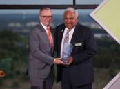 Prime Minister Anthony Albanese presents Professor Tom Calma with the Senior Australian of the Year award. Picture by James Croucher
