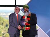 Prime Minister Anthony Albanese presents Amar Singh with the Local Hero of the Year award. Picture by James Croucher