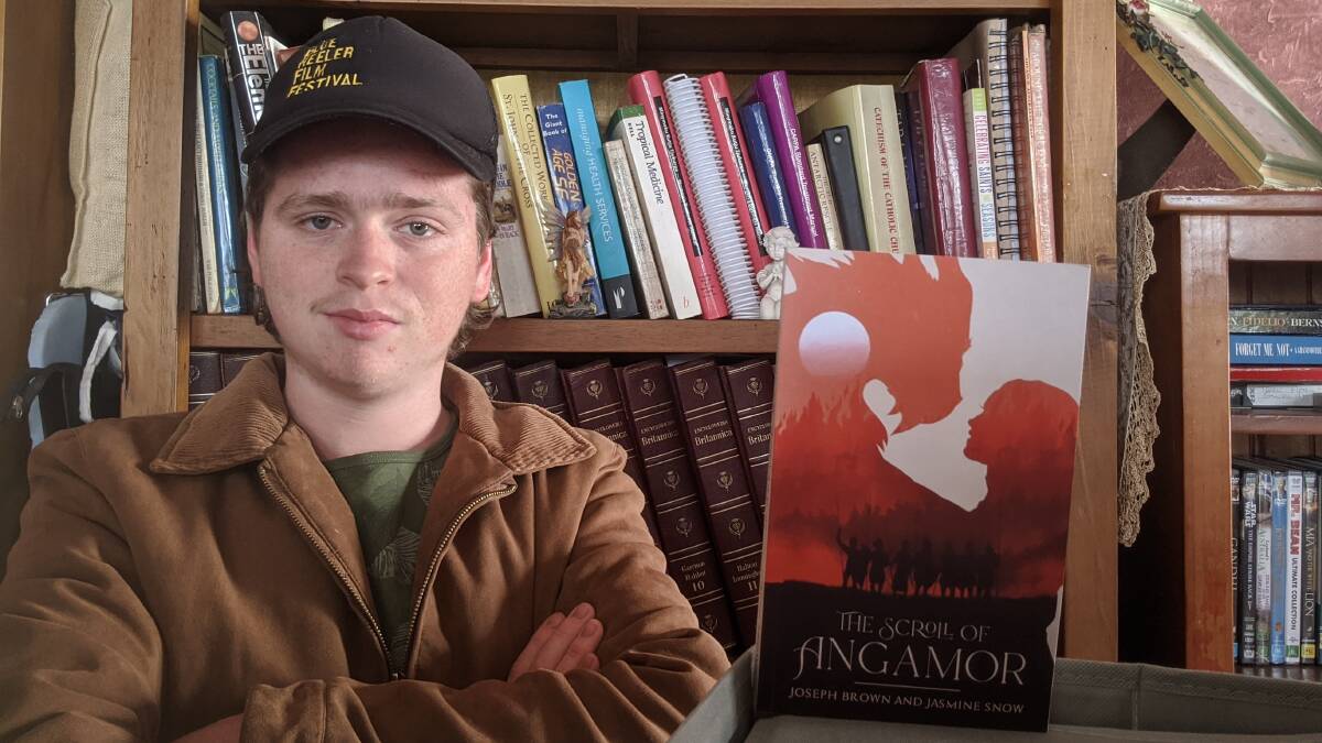 PUBLISHED: Aberdeen's Joseph Brown, 17, with a copy of his debut novel, The Scroll of Angamor.
