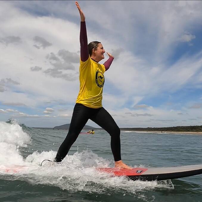 Former naval officer Angela Cooke has used surf therapy for 14 months and it's now the predominant tool she uses to manage her mental health. Image supplied.