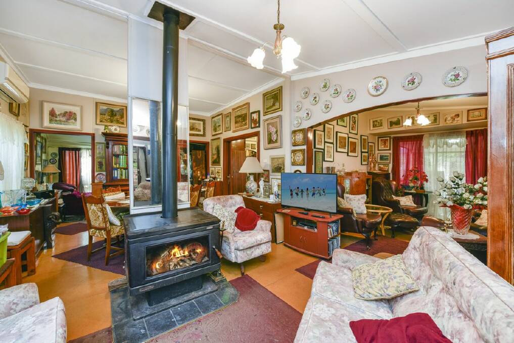 The home has plenty of charm including high panelled ceilings and a wood fireplace. Picture supplied