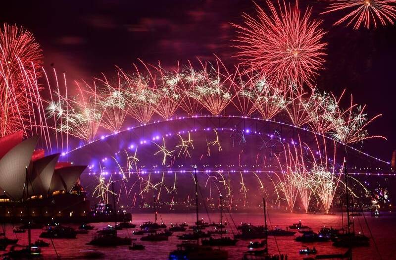 The BoM is warning people camping out during the day for Sydney's famous fireworks display to bring a jacket or an umbrella. Picture by Dean Lewins / AAP PHOTOS