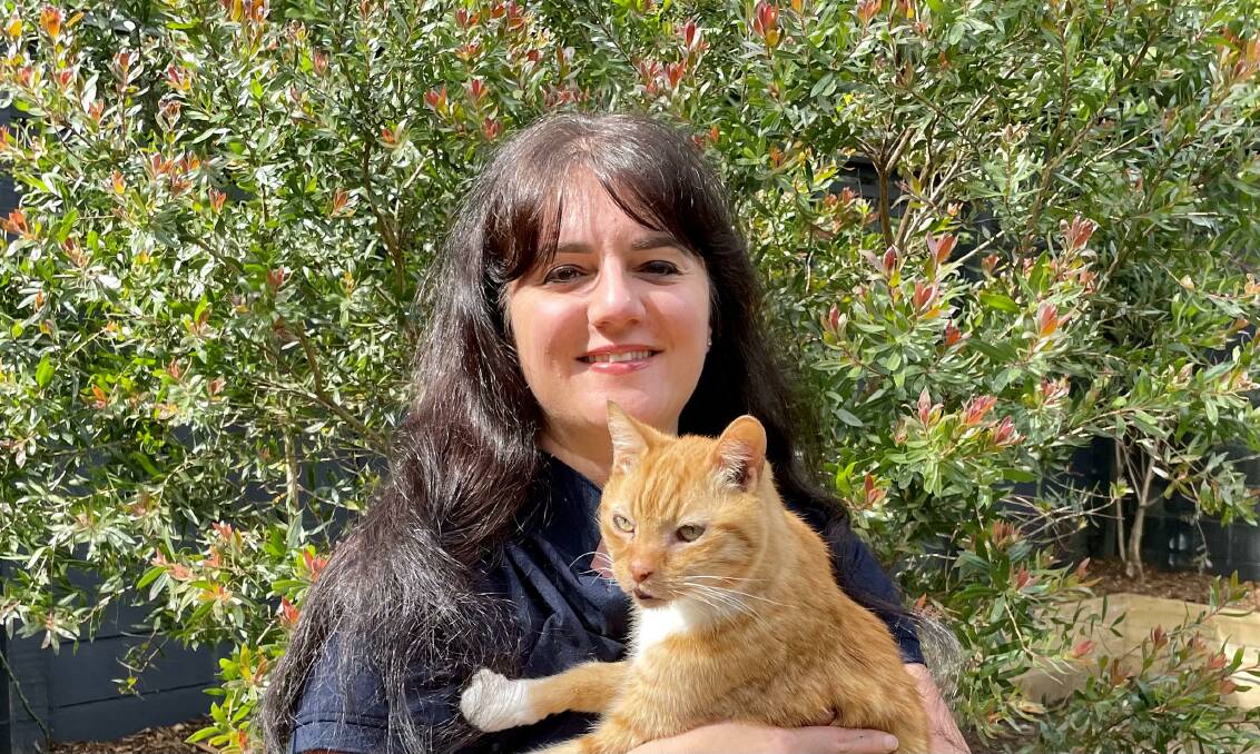 RSCPA's Sarah Zito with 19-year-old cat Indiana Jones. Picture supplied 