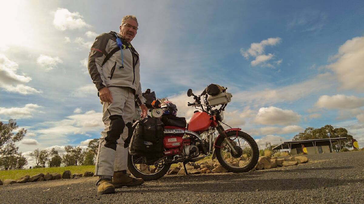 SIZE DOESN'T COUNT: Gavin Kleinhans has circumnavigated Australia on a 95cc postie bike. Photo supplied. 