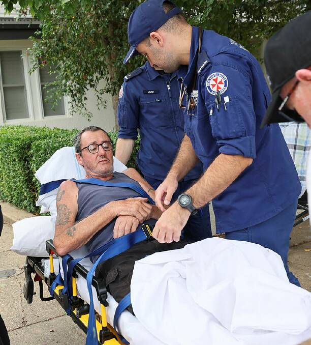 Warren Acott's interstate trek to mow down MND turned dramatic after he fell from a wheelchair in Central Wagga on Sunday morning. Picture by Les Smith