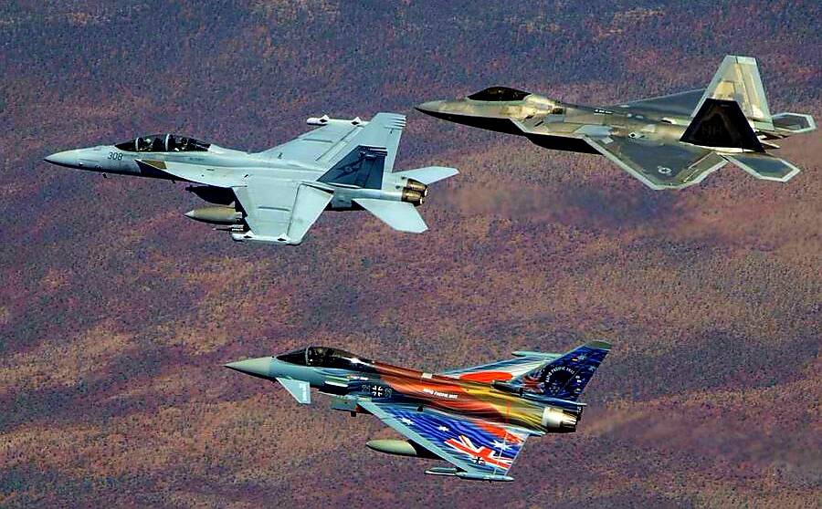 The German Luftwaffe 'Air Ambassador' EF-2000 Eurofighter Typhoon with special livery, together with a Royal Australian Air Force EA-18G Hornet and a US F-22 Raptor in Territory skies. Picture via Twitter Team Luftwaffe. 