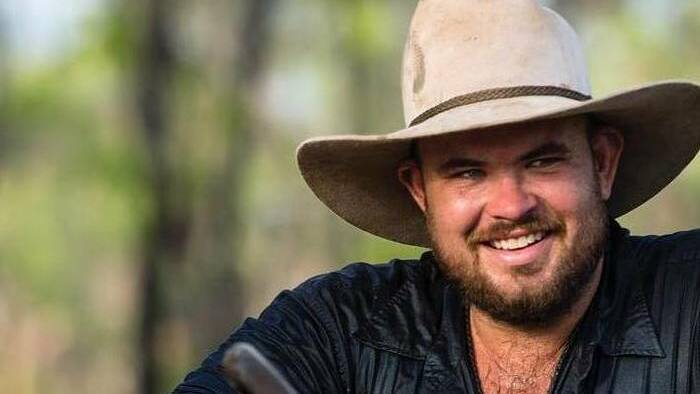 An arrest warrant has been issued for a 43-year-old man following an ongoing investigation into the helicopter crash in West Arnhem Land in February that killed Outback Wrangler star Chris 'Willow' Wilson.